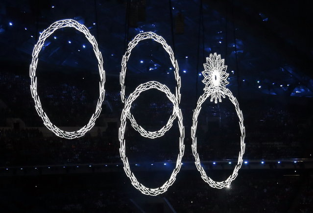One of the Olympic rings fails to open during a portion of the show where snowflakes were supposed to transition to rings during the opening ceremony of the 2014 Winter Olympics in Sochi, Russia, Friday, February 7, 2014. (Photo by Ivan Sekretarev/AP Photo)