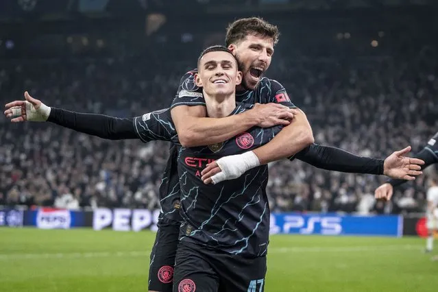 Manchester City's Phil Foden, front, celebrates after scoring his team's third goal during the Champions League, Round of Sixteen first leg, soccer match between FC Copenhagen and Manchester City in Copenhagen, Denmark, Tuesday, February 13, 2024. (Photo by Mads Claus Rasmussen/Ritzau Scanpix via AP Photo)