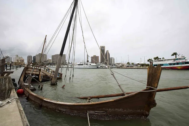 In this Tuesday, April 23, 2019 photo, the replica of Columbus' La Niña ship sits sunken at the Corpus Christi Marina, in Corpus Christi, Texas. The docked replica that sank in 2017 days after Hurricane Harvey struck Texas has swamped again. Officials say divers will examine La Nina at the Corpus Christi Marina before efforts begin to refloat the ship that sank Tuesday. (Photo by Courtney Sacco/Corpus Christi Caller-Times via AP Photo)