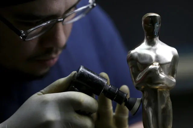 Leo Sotelo works on an Oscar statuette at the Polich Tallix Fine Art Foundry in Rock Tavern, N.Y., Thursday, January 12, 2017. (Photo by Seth Wenig/AP Photo)