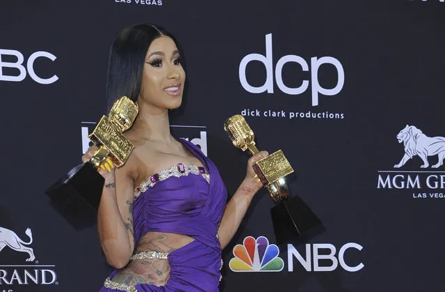 Cardi B poses in the press room with her awards at the Billboard Music Awards on Wednesday, May 1, 2019, at the MGM Grand Garden Arena in Las Vegas. Her song “Girls Like You” won for top hot 100 song, top selling song, top radio song and top collaboration. She also won top rap song for “I Like It” and top rap female artist. (Photo by Richard Shotwell/Invision/AP Photo)