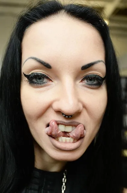 Body piercing artist Aneta von Cyborg shows off her cleaved tongue at the 2017 Tattoo Collective event at the Old Truman Brewery in London, England on February 17, 2017. (Photo by PA Wire)