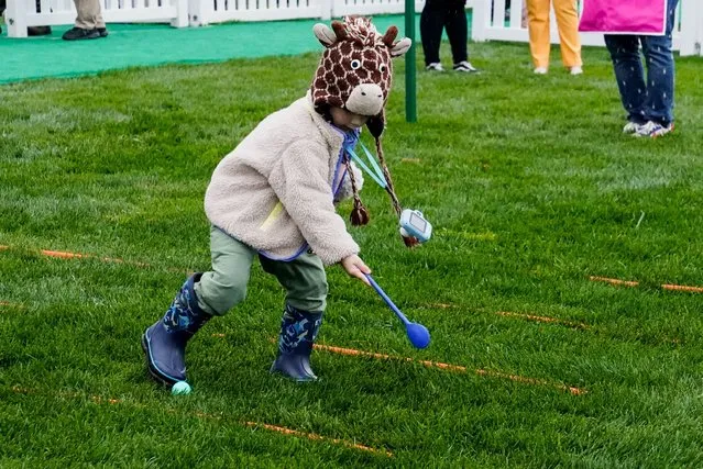 A child plays on the day of the annual Easter Egg Roll, on the South Lawn of the White House, on April 1, 2024. (Photo by Elizabeth Frantz/Reuters)
