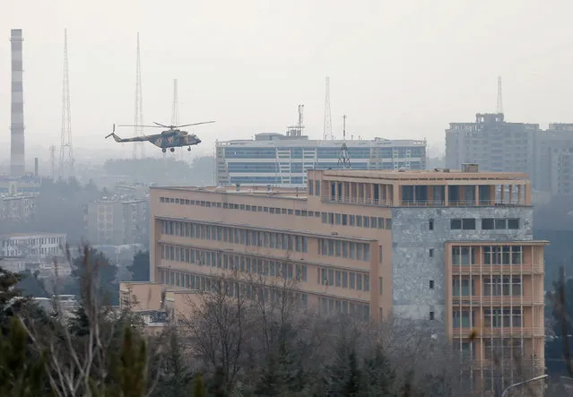 Afghan National Army (ANA) helicopter arrives to bring soldiers on a military hospital during gunfire and blast in Kabul, Afghanistan March 8, 2017. (Photo by Mohammad Ismail/Reuters)