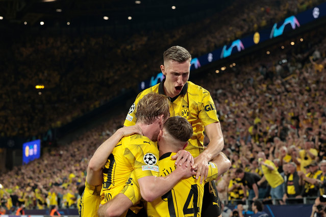 Niclas Fullkrug of Borussia Dortmund celebrates 1-0 with Julian Brandt of Borussia Dortmund Nico Schlotterbeck of Borussia Dortmund during the UEFA Champions League match between Borussia Dortmund v Paris Saint Germain at the Signal Iduna Park on May 1, 2024 in Dortmund Germany (Photo by Rico Brouwer/Soccrates/Getty Images)