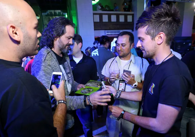 IMAGE DISTRIBUTED FOR MICROSOFT -Kudo Tsunoda, Corporate Vice President, Microsoft Studios, interacts with gamers at the Xbox Media Showcase at E3 in Los Angeles on Monday, June 15, 2015. (Photo by Casey Rodgers/Invision for Microsoft/AP Images)