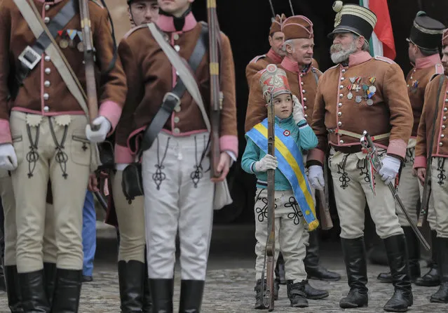 Ethnic Hungarians wearing Hussar uniforms take part in a parade in Targu Secuiesc, Romania, Wednesday, March 15, 2017. (Photo by Vadim Ghirda/AP Photo)