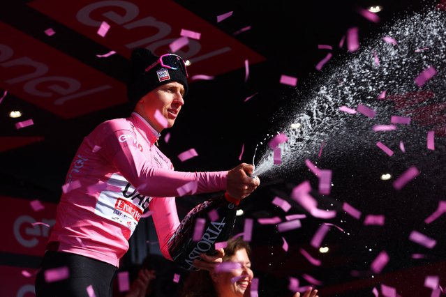 Pink jersey, Team UAE's Slovenian rider Tadej Pogacar celebrates on the podium after winning the 8th stage of the 107th Giro d'Italia cycling race, 152km between Spoleto and Prati di Tivo, on May 11, 2024. (Photo by Luca Bettini/AFP Photo)