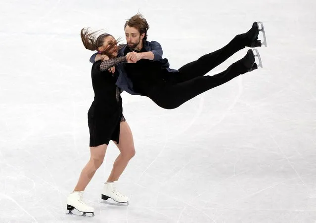 Kaitlin Hawayek and Jean-Luc Baker of Team United States skate during the Ice Dance Rhythm Dance on day eight of the Beijing 2022 Winter Olympic Games at Capital Indoor Stadium on February 12, 2022 in Beijing, China. (Photo by Evelyn Hockstein/Reuters)