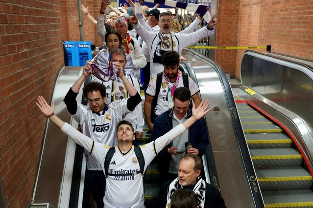 Real Madrid fans travel down an escalator at Waterloo Station to travel on the tube to Wembley to watch the Champions League Final in London on June 1, 2024. (Photo by Kevin Coombs/Reuters)