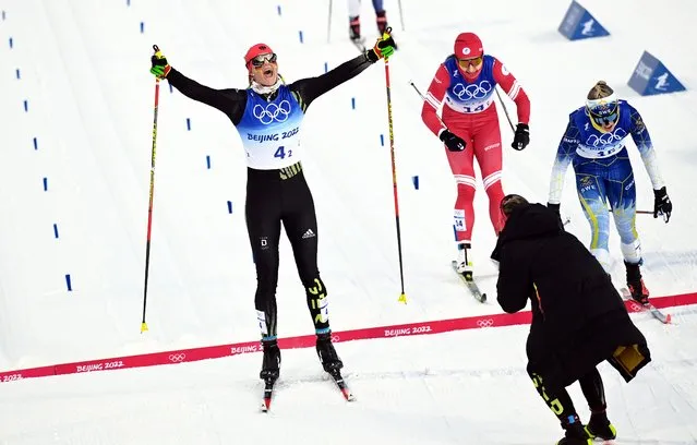 Victoria Carl (L) of Germany crosses the finish line winning the Women's Team Sprint final at the Zhangjiakou National Cross-Country Skiing Centre at the Beijing 2022 Olympic Games, Zhangjiakou, China, 16 February 2022. (Photo by Vassil Donev/EPA/EFE)