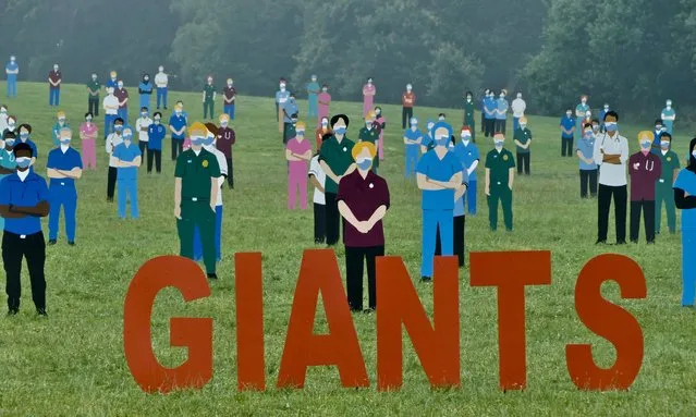 “Standing with Giants” created by Dan Barton remembers those who have given so much, with many paying the ultimate price for the freedom and benefit of others at South Park, Headington, Oxford on July 25, 2021. There are 60 different design configurations which have all been hand cut by one of the volunteers from recycled building waste. The 300 figures have all been hand painted by a team of dedicated and hard working local volunteers during their spare time over the past 3 months. Tributes can be written on the backs of the silhouettes and money raised with go to NHS Charities together. (Photo by Geoffrey Swaine/Rex Features/Shutterstock)