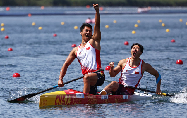 China's gold medallists Liu Hao and Ji Bowen celebrate winning in the men's canoe double 500m final of the canoe sprint competition at Vaires-sur-Marne Nautical Stadium in Vaires-sur-Marne during the Paris 2024 Olympic Games on August 8, 2024. (Photo by Yara Nardi/Reuters)