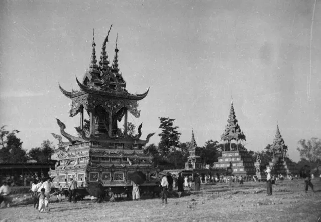 A Burmese priest's body is prepared for cremation in a large ornate 'chariot' like a small temple, circa 1930. (Photo by General Photographic Agency/Getty Images)