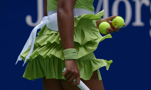 Japan's Naomi Osaka serves against Latvia's Jelena Ostapenko during their women's singles first round match on day two of the US Open tennis tournament at the USTA Billie Jean King National Tennis Center in New York City, on August 27, 2024. (Photo by Timothy A. Clary/AFP Photo)