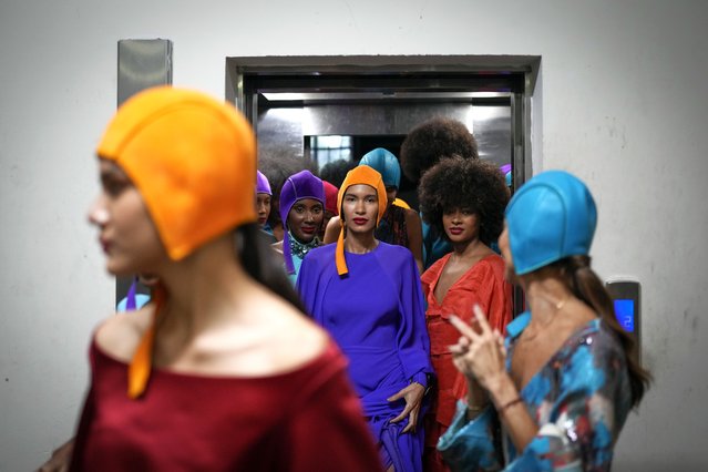 Models, wearing a creation from the Marcos Luengo collection, exit an elevator after performing in Panama Fashion Week in Panama City, Thursday, September 19, 2024. (Photo by Matias Delacroix/AP Photo)