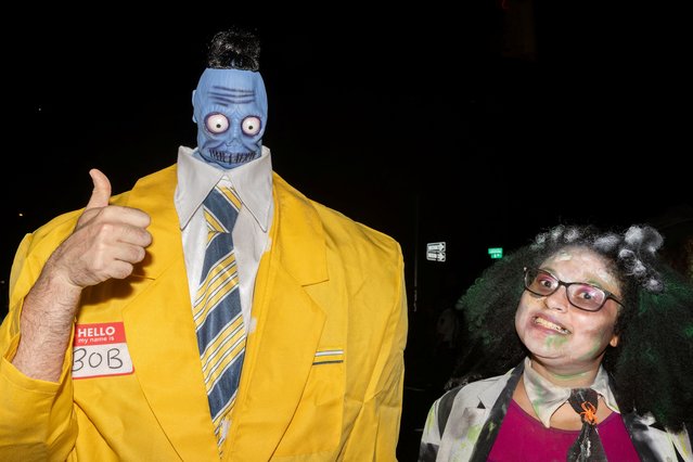 People take part in the annual NYC Halloween Parade in Manhattan, New York City on October 31, 2024. (Photo by Jeenah Moon/Reuters)