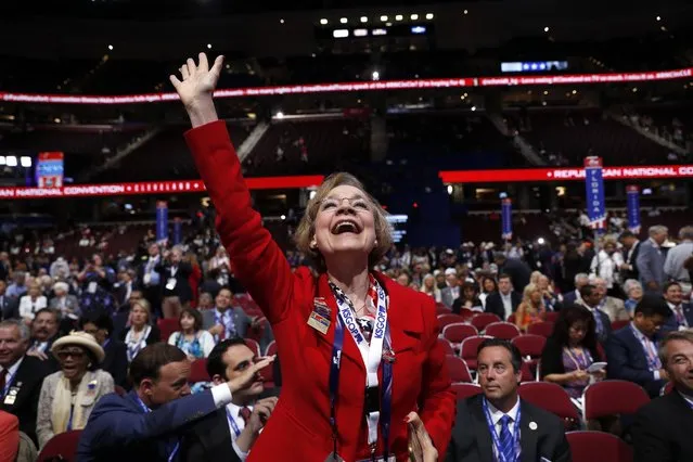 Kansas delegate Beverly Gossage cheers as Sen. Pat Roberts, R-Kan., speaks during first day of the Republican National Convention in Cleveland, Monday, July 18, 2016. (Photo by Carolyn Kaster/AP Photo)