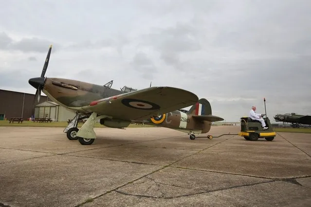 A Hawker Hurricane Mk XIIa 5711 (G-HURI) fighter aircraft prepares to perform an aerobatic display at the IWM Duxford on October 18, 2012 in Duxford, England. The aeroplane, similar to those that defended British shores during the Battle of Britain in World War II, is due to be auctioned by Bonhams in their sale of “Collectors' Motor Cars and Automobilia” at Mercedes-Benz World Brooklands on December 3, 2012. The plane was built in 1942 and joined the Royal Canadian Air Force the following year, where it remained for the duration of the war, it is expected to fetch up to 17 million GBP.  (Photo by Oli Scarff)
