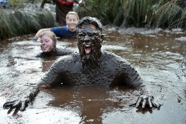 A competitor takes part in the Mud Madness race at Foymore Lodge on September 13, 2015 in Portadown, Northern Ireland. Adrenaline junkies of all ages compete in the mud-soaked challenge to help raise money for those living with terminal illnesses. (Photo by Charles McQuillan/Getty Images)