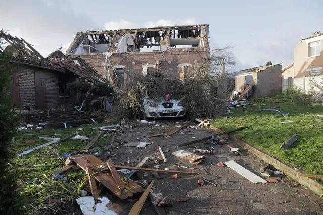 Destroyed homes are seen after a tornado struck the area in Bihucourt, northern France, Monday, October 24, 2022. Tornado-like storms that tore through northern France sheared off part of a church roof, felled trees and power lines and left scores of people without a safe place to live, authorities said Monday. One person suffered light injuries in the storms Sunday and some 150 people were evacuated, according to the regional administration for the Pas-de-Calais region. (Photo by Michel Spingler/AP Photo)