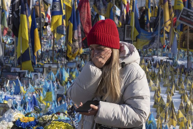 A woman cries at the memorial to the fallen Ukrainian soldiers on Independence Square in Kyiv, Ukraine, Monday, February 24, 2025. (Photo by Efrem Lukatsky/AP Photo)