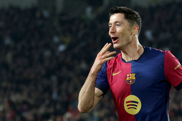 Barcelona's Polish forward #09 Robert Lewandowski celebrates after scoring his team's third goal during the Spanish league football match between FC Barcelona and CA Osasuna at Estadi Olimpic Lluis Companys in Barcelona on March 27, 2025. (Photo by Lluis Gene/AFP Photo)