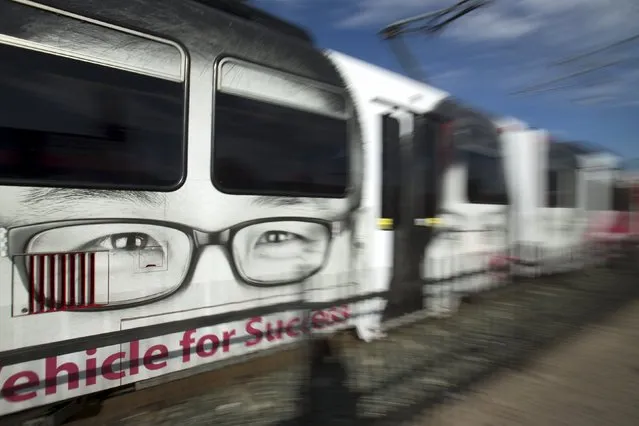Advertising wraps an electric trolly as it departs a transit hub in the border town of San Ysidro, California September 2, 2015. (Photo by Mike Blake/Reuters)