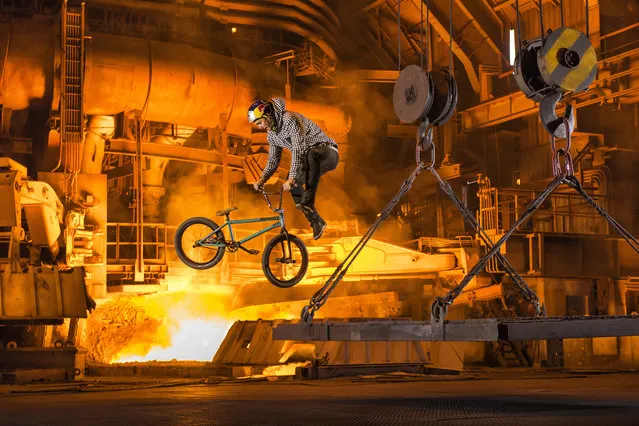 Vasya Lukyanenko performs near Blast Furnace during the Stainless project in Zaporizhzhya, Ukraine on October 14, 2015. (Photo by Sergey Illin/Red Bull/SWNS.com)