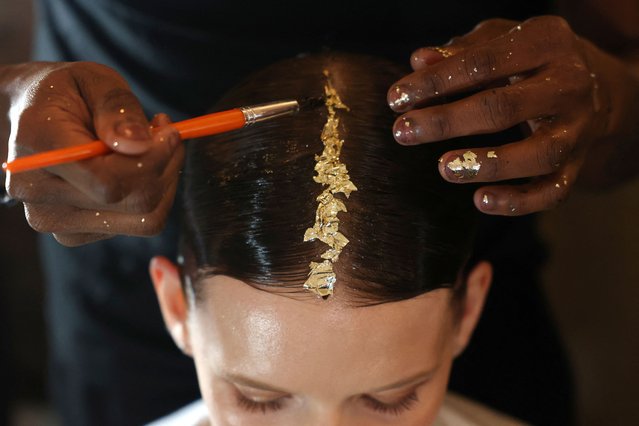 A model is prepared backstage before the Christian Siriano Fall/Winter 2024 collection show at New York Fashion Week, in New York City, U.S., February 8, 2024. (Photo by Andrew Kelly/Reuters)