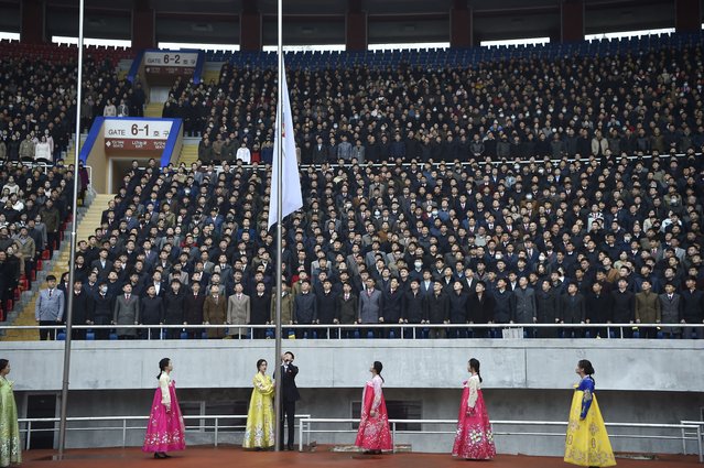Spectators stand during a flag rising ceremony at the 31st Pyongyang International Marathon at Kim Il Sung Stadium in Pyongyang on April 6, 2025, as part of celebrations marking the birth of North Korea's founding leader Kim Il Sung in 1912. The last edition of the Pyongyang Marathon was held in 2019 before the pandemic, during which the nuclear-armed state sealed its borders in an effort to contain the virus. (Photo by Kim Won Jin/AFP Photo)