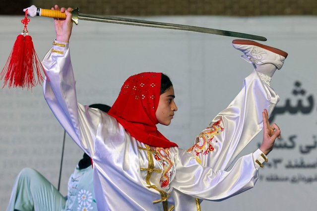 An Iranian woman competes in the women's Taijiquan competition in Tehran on February 21, 2025. (Photo by Atta Kenare/AFP Photo)