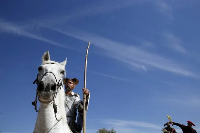 An actor performing as literary character Don Quixote parades during the annual Cervantes market (Mercado Cervantino) in the hometown of famous Spanish writer Miguel de Cervantes, Alcala de Henares, Spain, October 9, 2015. (Photo by Susana Vera/Reuters)