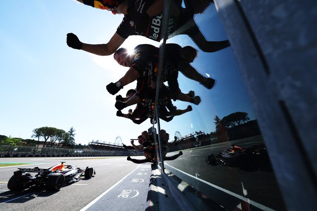 Race winner Max Verstappen of the Netherlands driving the (1) Oracle Red Bull Racing RB21 crosses the line to cheers from his team on the pit wall during the F1 Grand Prix of Emilia-Romagna at Autodromo Internazionale Enzo e Dino Ferrari on May 18, 2025 in Imola, Italy. (Photo by Mark Thompson/Getty Images)