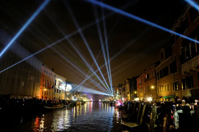 Cannaregio Channel is illuminated during the opening ceremony of the Carnival in Venice, Italy January 27, 2018. (Photo by Manuel Silvestri/Reuters)