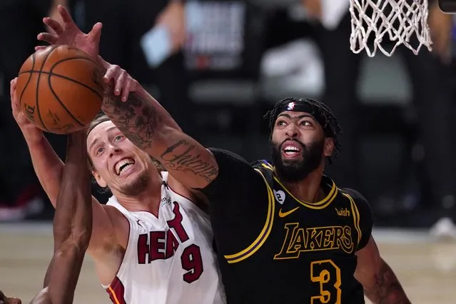 Miami Heat forward Kelly Olynyk (9) and Los Angeles Lakers forward Anthony Davis (3) compete for control of a rebound during the second half of Game 2 of basketball's NBA Finals, Friday, October 2, 2020, in Lake Buena Vista, Fla. (Photo by Mark J. Terrill/AP Photo)