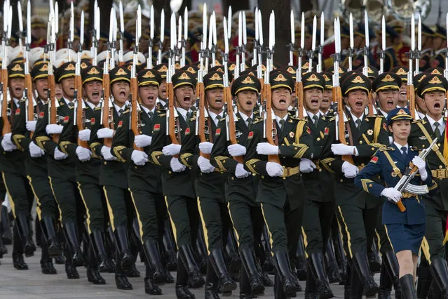 Members of a Chinese guard of honor march during a welcome ceremony for Dutch King Willem-Alexander outside the Great Hall of the People in Beijing, China, Monday, October 26, 2015. (Photo by Ng Han Guan/AP Photo)