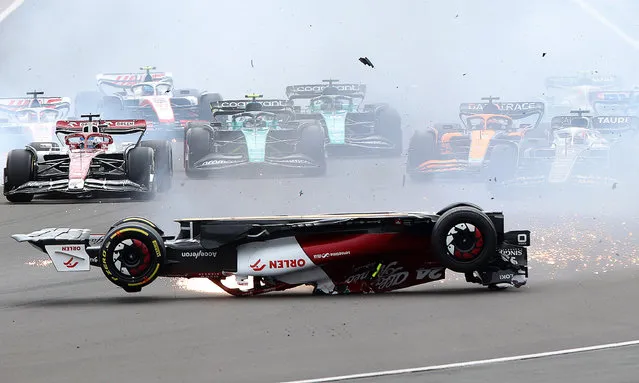 Alfa Romeo’s Guanyu Zhou and Mercedes’ George Russell crash out at the start of the British Grand Prix at Silverstone, Northamptonshire, on July 3, 2022. (Photo by Molly Darlington/Reuters)