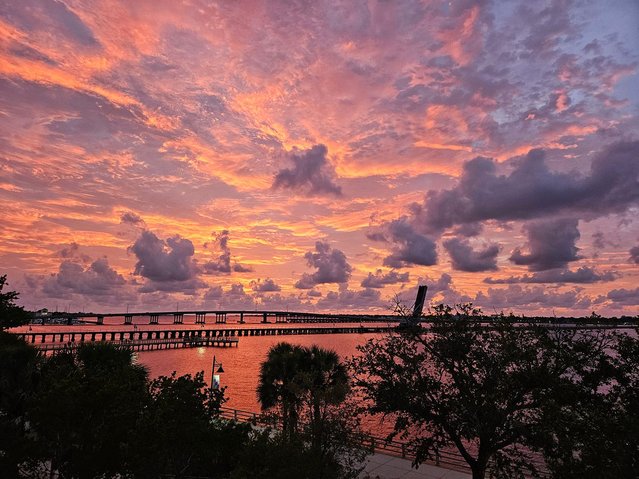 Dust from the Sahara Desert in northern Africa has recently affected Florida's air and is visible during sunset over the Manatee River in this photo, taken from above the Bradenton Riverwalk on July 11, 2024. (Photo by Wade Tatangelo/Sarasota Herald-Tribune/USA TODAY Network)