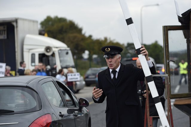 Anti-Brexit campaigners, Borders Against Brexit, set up a mock customs search during a protest against Britain's vote to leave the European Union, at the border town of Carrickcarnon in Ireland October 8, 2016. (Photo by Clodagh Kilcoyne/Reuters)