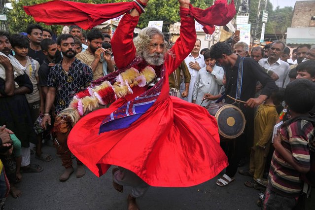 A spiritual path devotee locally called 'Malang' performs traditional Sufi trance dance called 'Dhamaal' during celebrations of the three-day annual festival or 'Urs' of mystic and scholar, Hazrat Ali Hajveri, popularly known as Data Ganj Bakhsh at his shrine, in Lahore, Pakistan, Wednesday, August 13, 2025. (Photo by K.M. Chaudary/AP Photo)