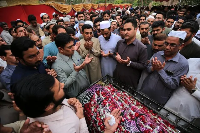 Relatives and funeral guests attend the funeral of Pakistani teenager Azan Afridi, one of the Pakistani victims of a boat wreck off the coast of Italy, in Peshawar, Pakistan, 15 March 2023. According to Afridi's family, the teenager was among the victims of a boat wreck on 26 February 2023 off the coast of Italy that left 69 people dead. His body was identified by his uncle in Italy. The seventh-grader Afridi was trying to pursue his dream of higher education. The tragedy highlights the lack of quality educational and economic opportunities in Pakistan and the increasing number of people using smugglers to transit through Turkey to enter Europe. (Photo by Bilawal Arbab/EPA/EFE)