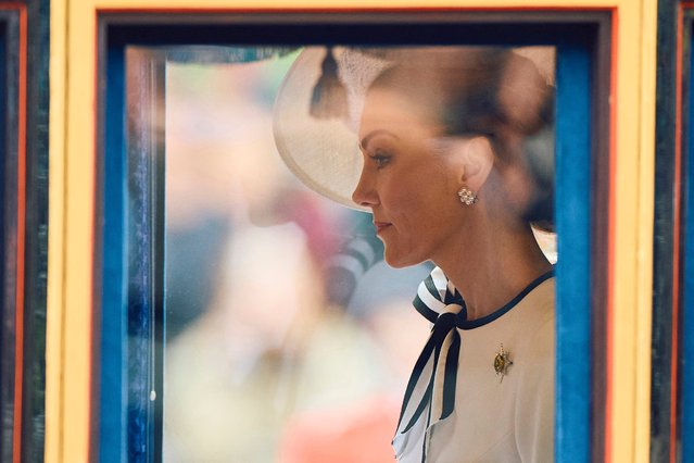 Britain's Catherine, Princess of Wales, rides inside the Glass State Coach at Horse Guards Parade during the King's Birthday Parade “Trooping the Colour” in London on June 15, 2024. Catherine, Princess of Wales, is making a tentative return to public life for the first time since being diagnosed with cancer, attending the Trooping the Colour military parade in central London. (Photo by Benjamin Cremel/AFP Photo)