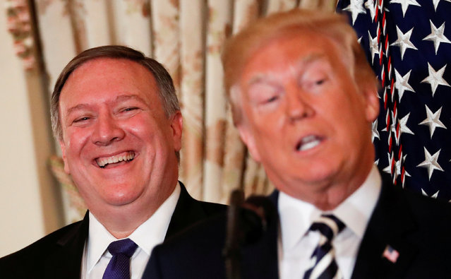 U.S. Secretary of State Mike Pompeo laughs as President Donald Trump speaks during a swearing-in ceremony for Pompeo at the State Department in Washington, U.S., May 2, 2018. (Photo by Jonathan Ernst/Reuters)