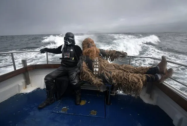 Fans dressed as Darth Vader and Chewbacca take a boat trip to the Skelligs on May 4, 2018 in Portmagee, Ireland. (Photo by Charles McQuillan/Getty Images)