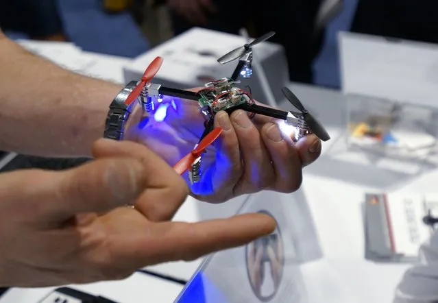 A vendor demonstrates the Micro Drone for a prospective retailer at the International Consumer Electronics show (CES) in Las Vegas, Nevada January 6, 2015. (Photo by Rick Wilking/Reuters)