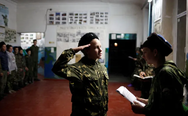 Students of the General Yermolov Cadet School and members of a Cossack community undergo military training at a boot camp set up by the Russkiye Vityazi (Russian Knights) military patriotic club in the village of Sengileyevskoye in Stavropol region, Russia, November 1, 2016. (Photo by Eduard Korniyenko/Reuters)