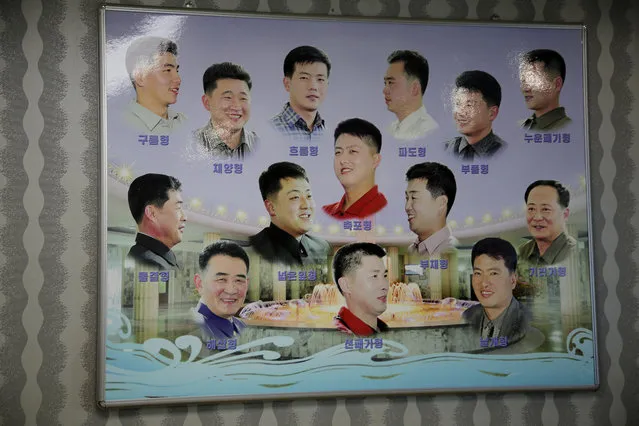 A poster showing different types of hair styles worn by North Korean men hangs outside a barber shop at the Munsu water park on Tuesday, December 1, 2015, in Pyongyang, North Korea. (Photo by Wong Maye-E/AP Photo)