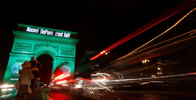 The Arc de Triomphe is illuminated in green with the words “Paris Agreement is Done”, to celebrate the Paris U.N. COP21 Climate Change agreement in Paris, France, November 4, 2016. (Photo by Jacky Naegelen/Reuters)