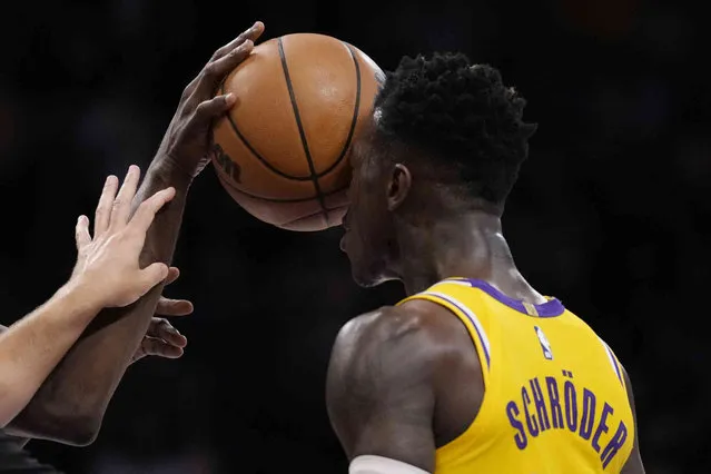 Los Angeles Lakers guard Dennis Schroder gets a ball shoved in his face by Golden State Warriors forward Draymond Green during the second half in Game 6 of an NBA basketball Western Conference semifinal series Friday, May 12, 2023, in Los Angeles. (Photo by Ashley Landis/AP Photo)